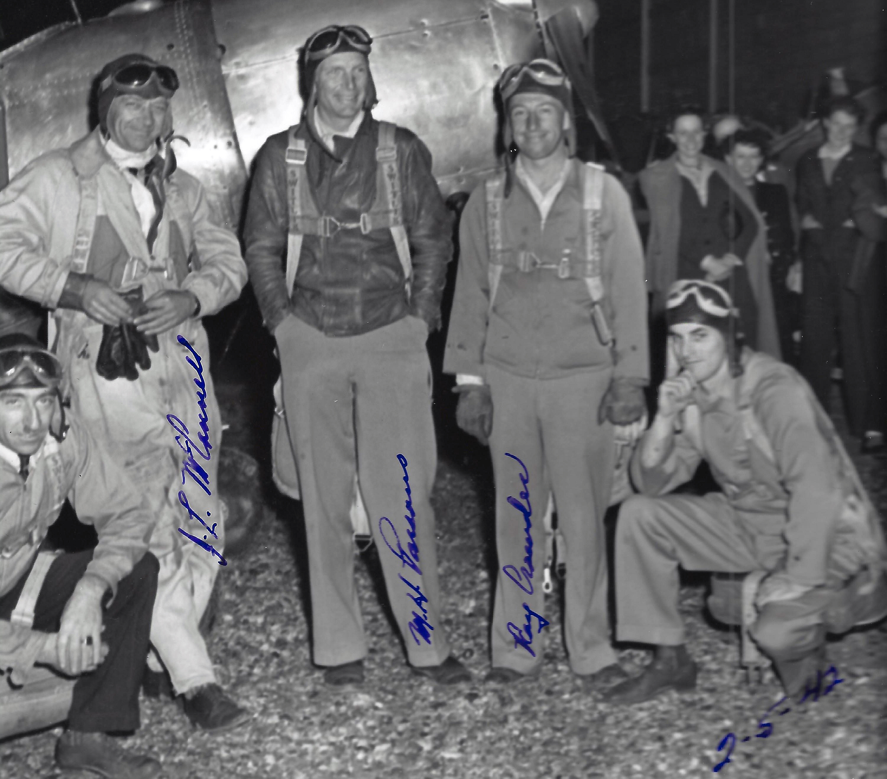 Val on the right, squatting down with a group of pilots Webb's Flying Service 1942_Elaine standing behind him (1)