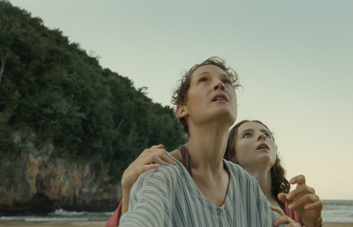 (from left) Prisca (Vicky Krieps) and Maddox (Thomasin McKenzie) in Old, written for the screen and directed by M. Night Shyamalan.